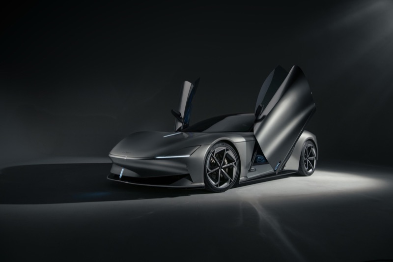 The Karma Kaveya concept car with its butterfly doors open in a studio setting